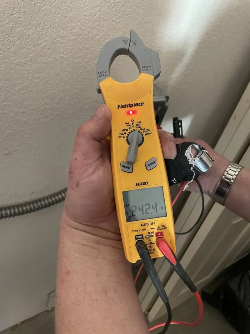 Voltage testing with clamp meter during Circuit Breaker Repair in Loudoun Valley Estates